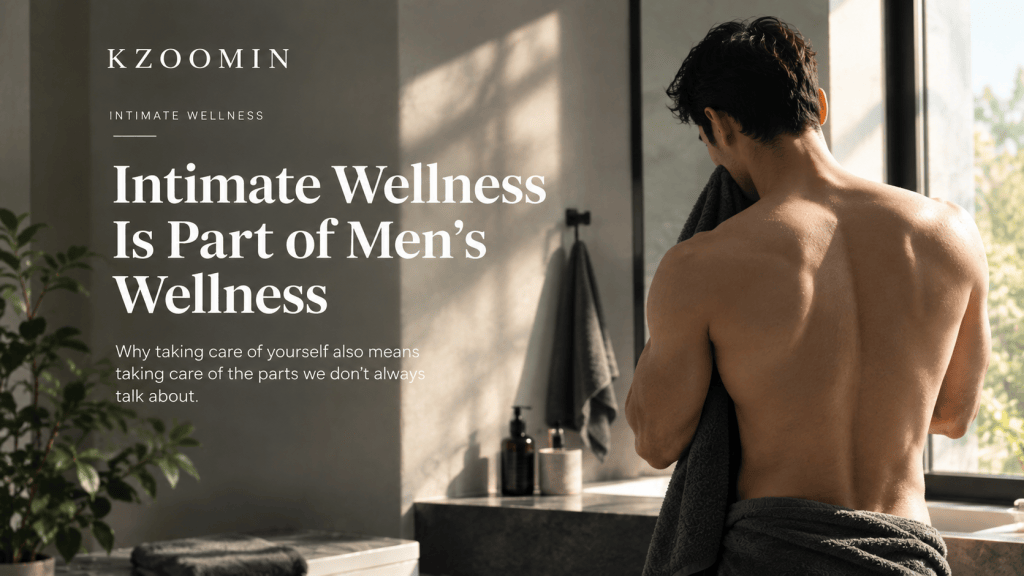 A shirtless man wrapped in a towel in a modern bathroom, representing intimate wellness and personal care.